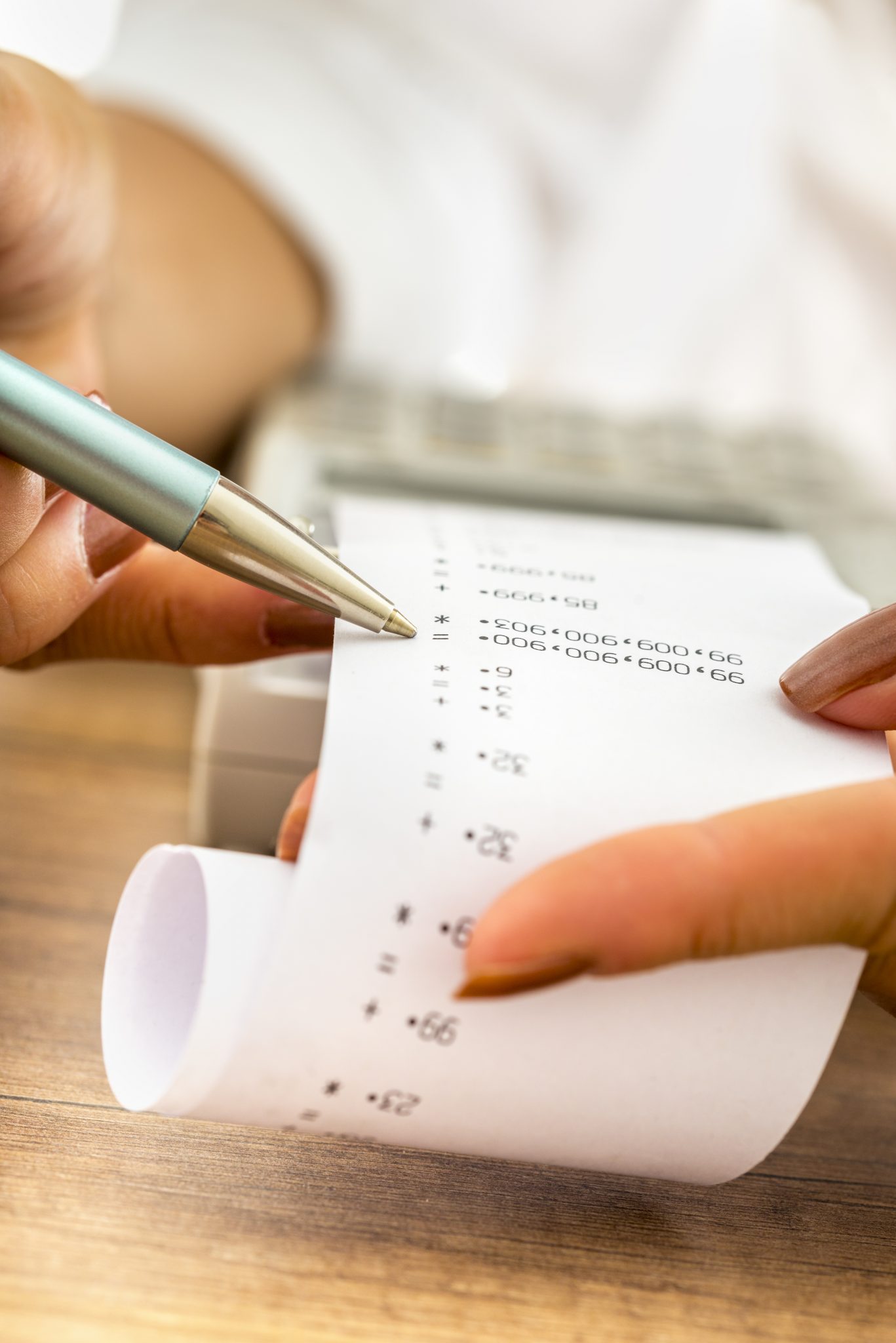 Closeup of female accountant working by checking a printout or r Accountant | Brock CPA Firm Jacksonville FL