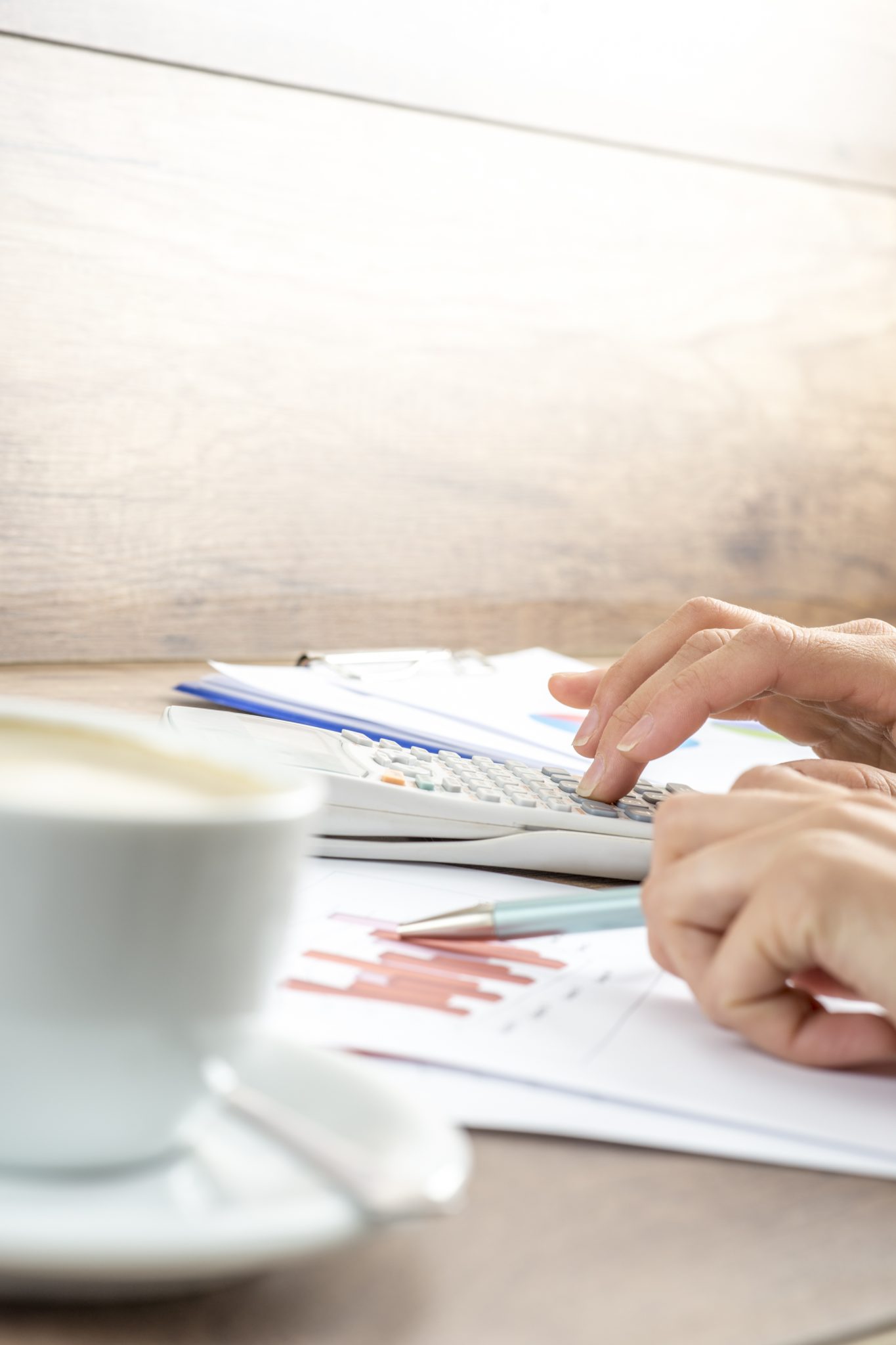 Closeup of female hands making mathematical and statistical calc Financial Management | Brock CPA Firm Jacksonville FL
